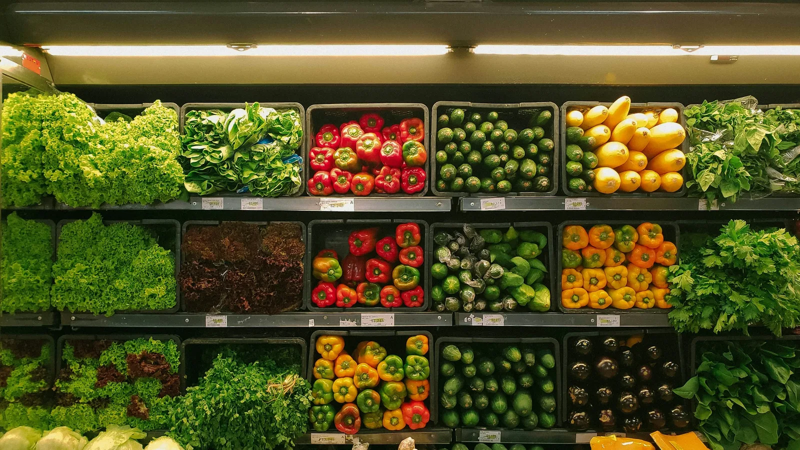Fresh groceries arranged beside a written weekly meal plan.